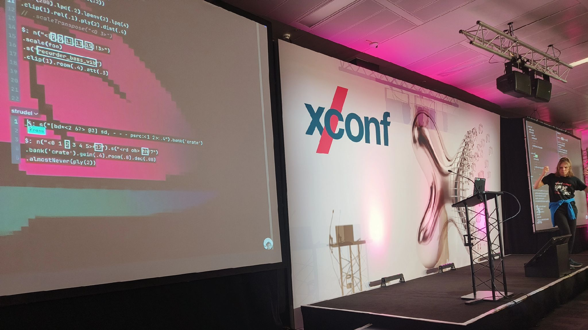 A photo of me speaking at XConf Europe.