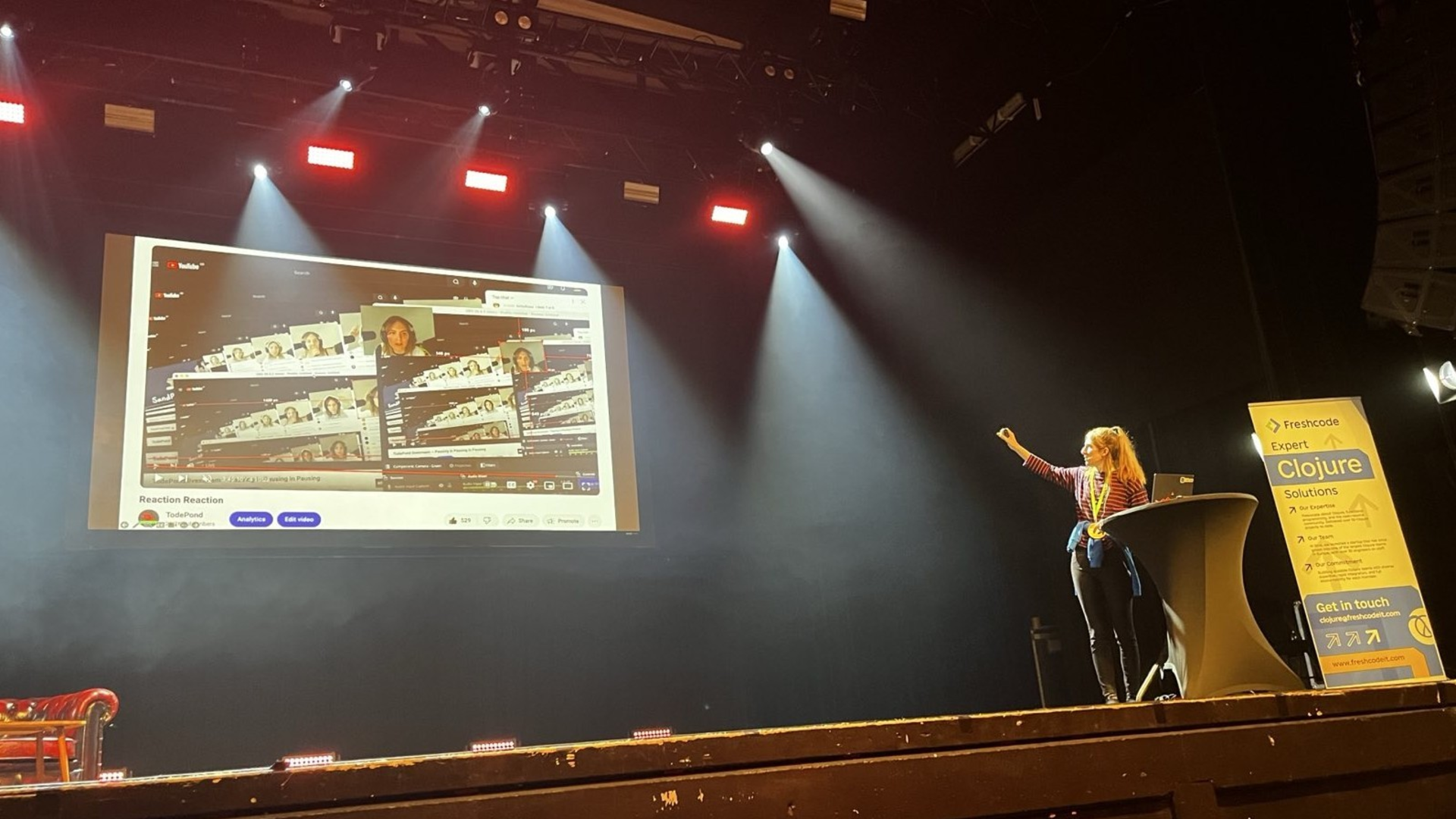 A photo of me speaking at Heart of Clojure.